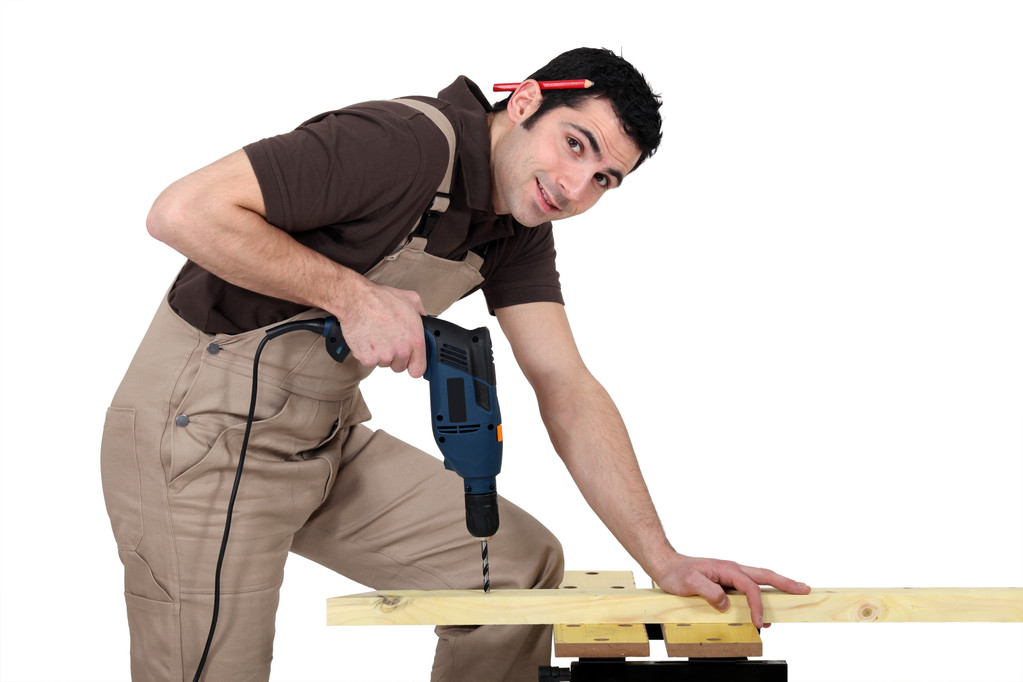 Handyman using a power tool - Photo, Image