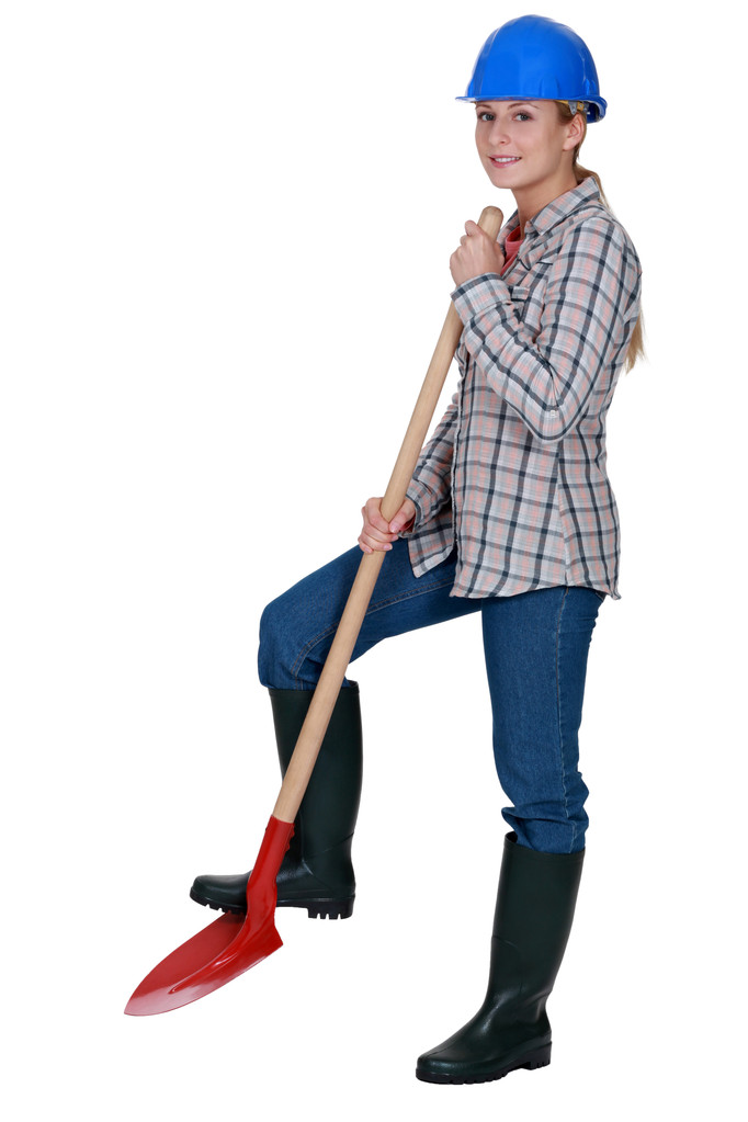 Woman construction worker with a shovel - Photo, Image