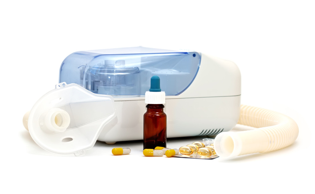 Ultrasonic nebulizer and medicines on a white background - Photo, Image