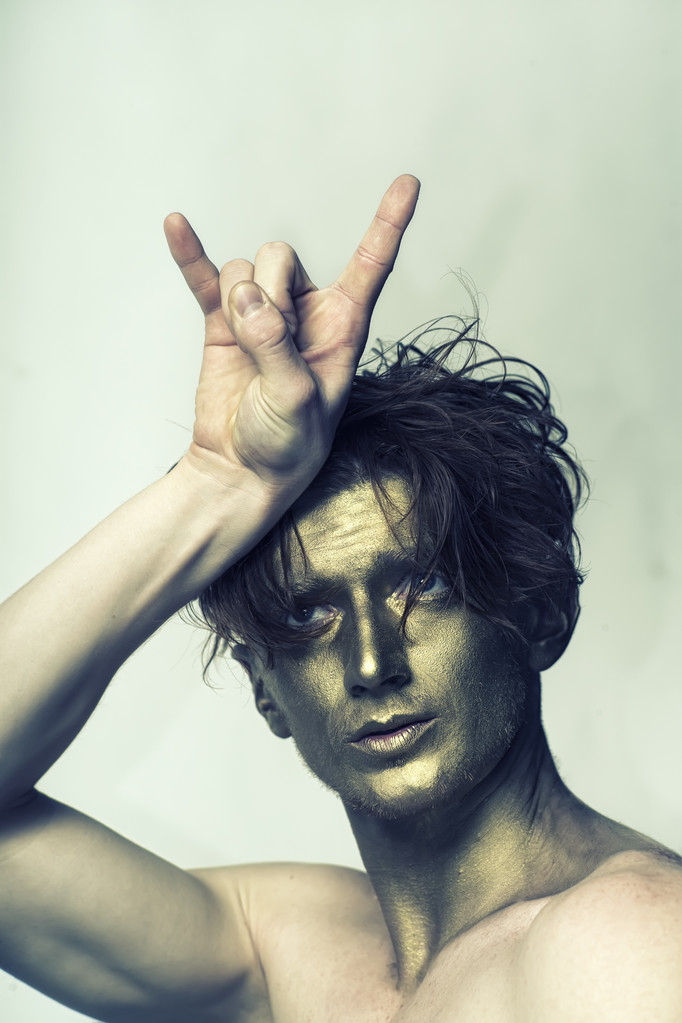 Gold man with cool gesture - Fotografie, Obrázek