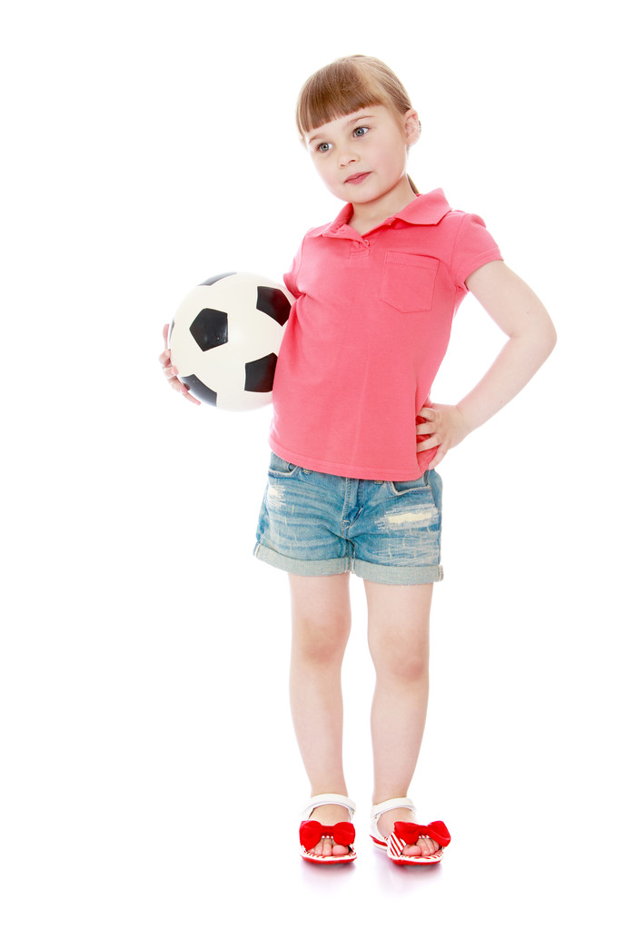 Tyttö, jolla on jalkapallo
 - Valokuva, kuva