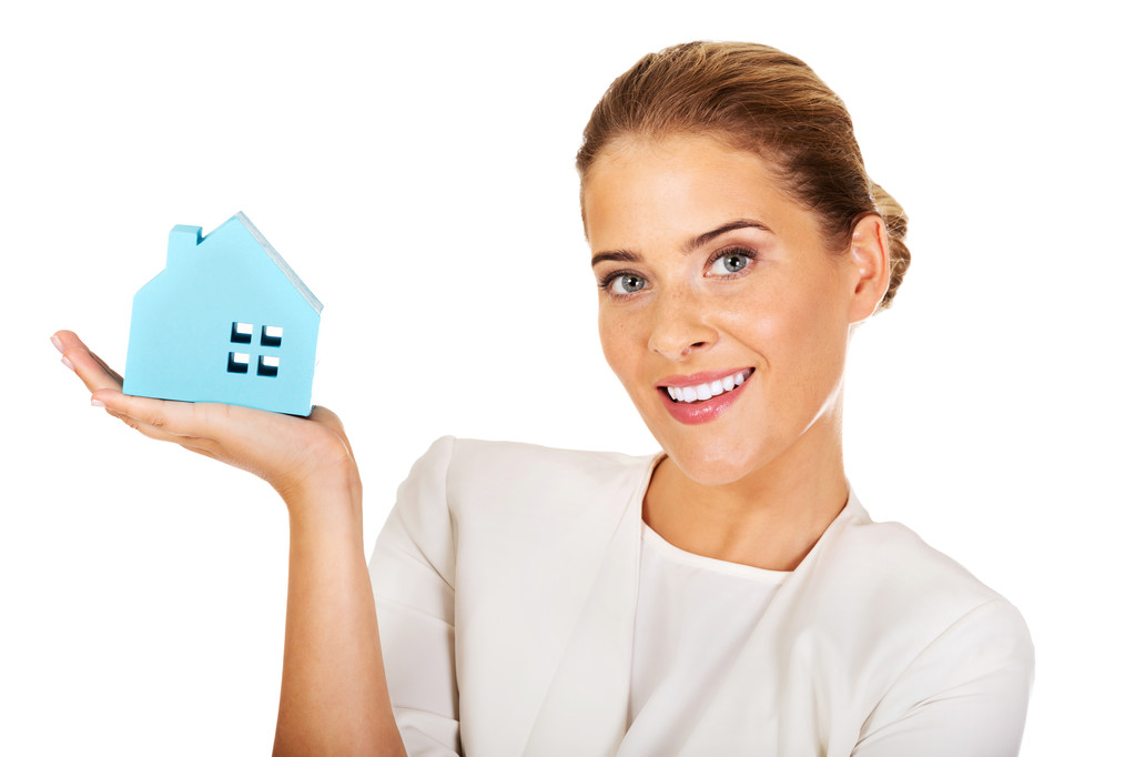 Smile businesswoman holding a paper house - Photo, Image