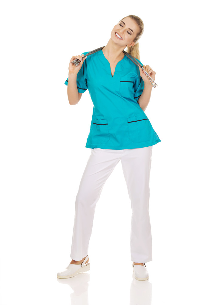 Happy doctor or nurse with stethoscope - Photo, Image
