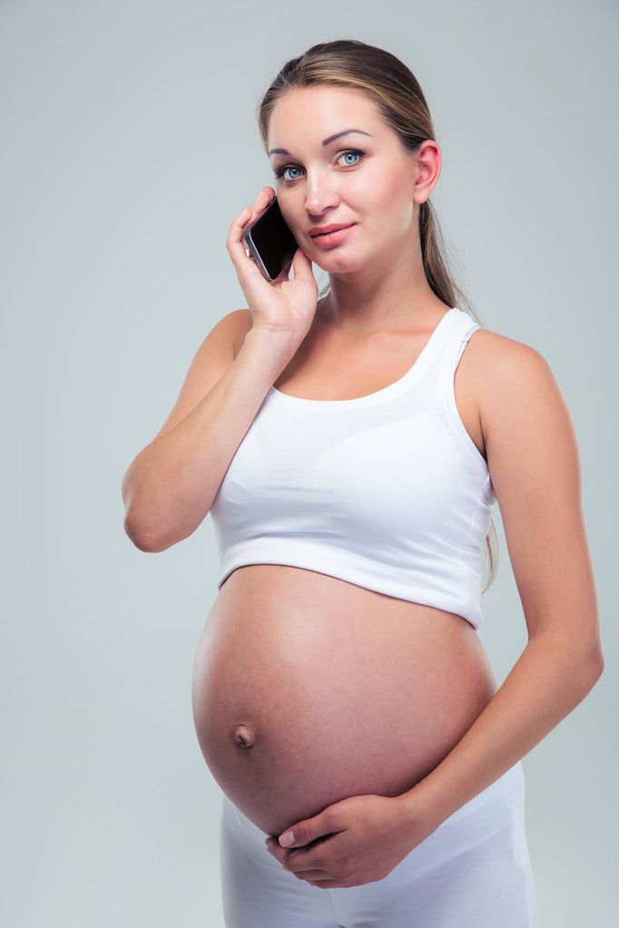 Pregnant woman talking on the phone - Photo, Image