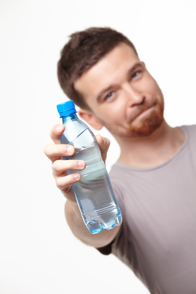Palackozott víz emberrel - Fotó, kép
