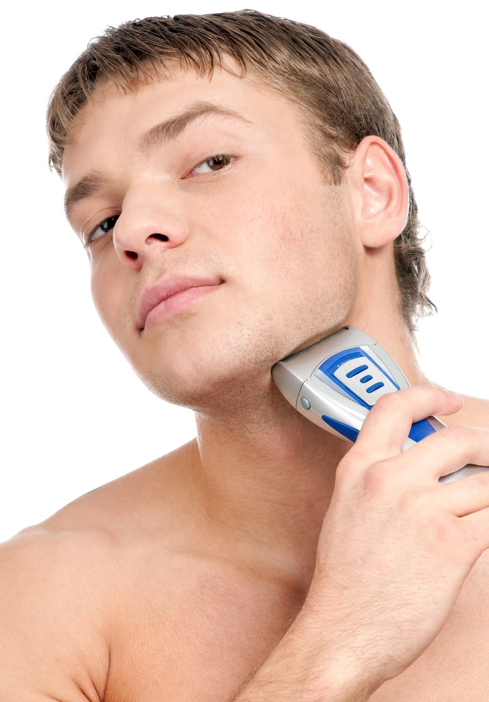 Портрет молодого красивого мужчины, бреющегося
 - Фото, изображение