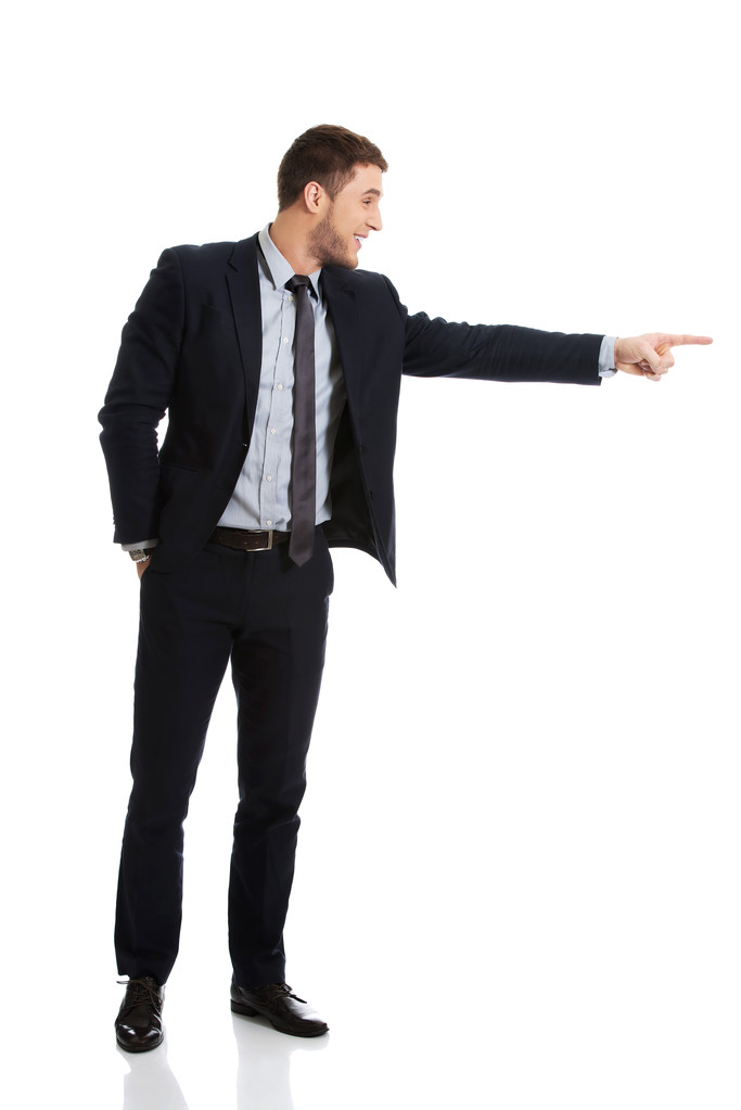 Happy businessman pointing his finger. - Photo, Image