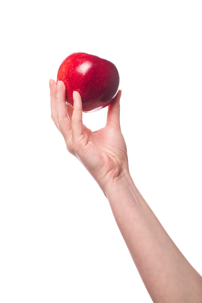 Жінка тримає органічне червоне смачне яблуко
 - Фото, зображення