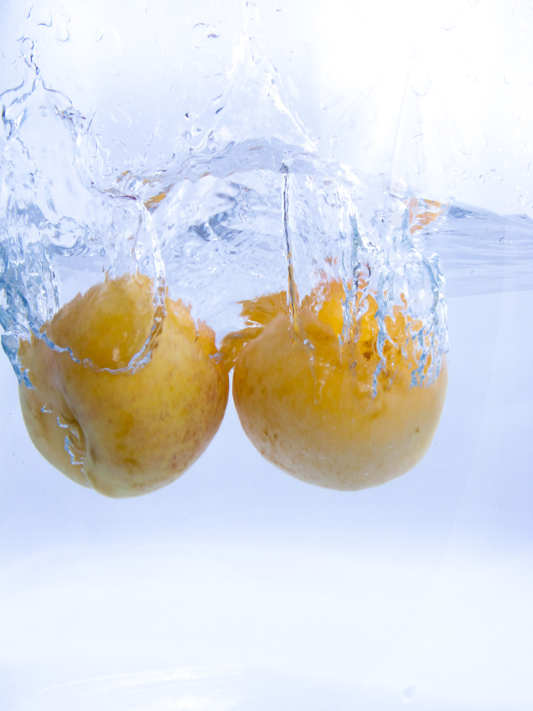 Fruits falling into the water - Photo, Image