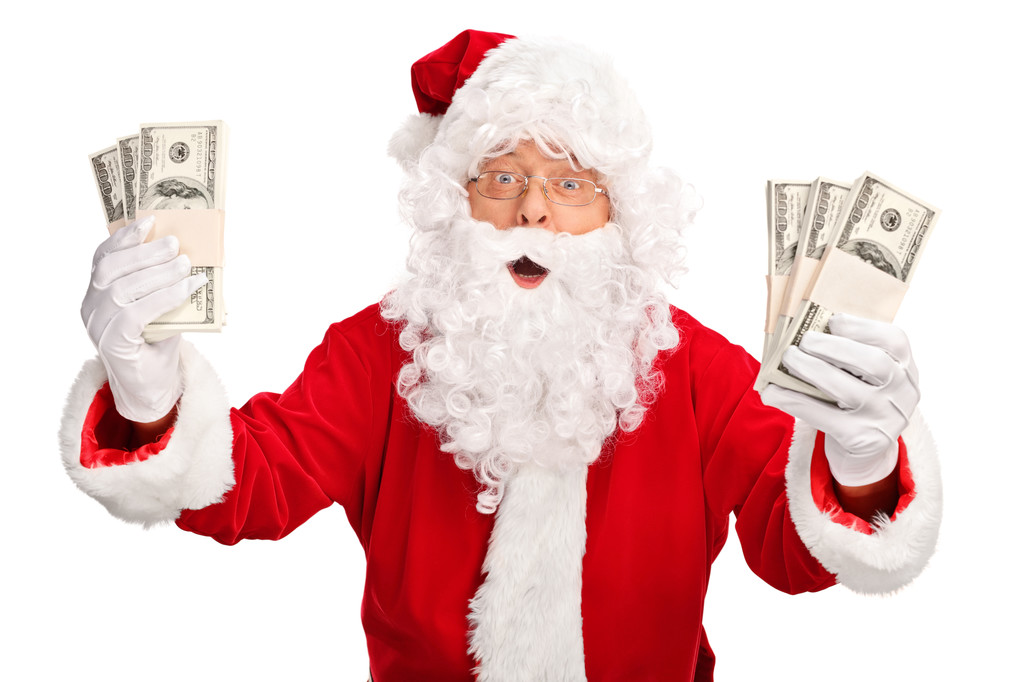 Санта-Клаус держит пачки денег
 - Фото, изображение