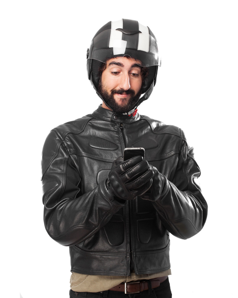 šťastný motorkář s mobilním telefonem - Fotografie, Obrázek