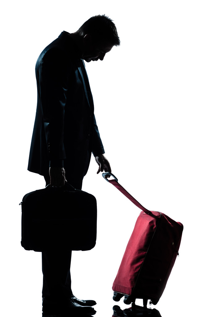 スーツケースと疲れている白人のビジネス旅行者の男 - 写真・画像