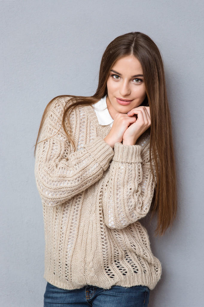 Portrait of young beautiful girl in knitted sweater - Photo, Image