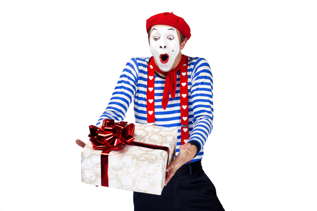 Mime with present.Emotional funny actor wearing sailor suit, red beret posing on white isolated background. - Zdjęcie, obraz