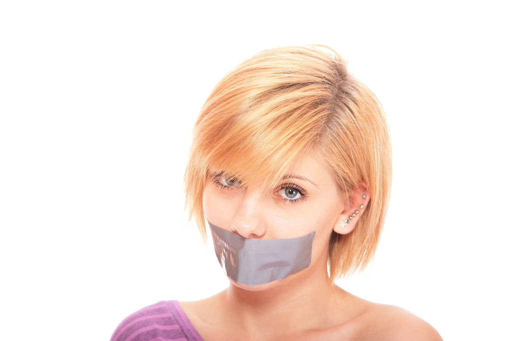 Beautiful woman with tape on mouth - Photo, Image
