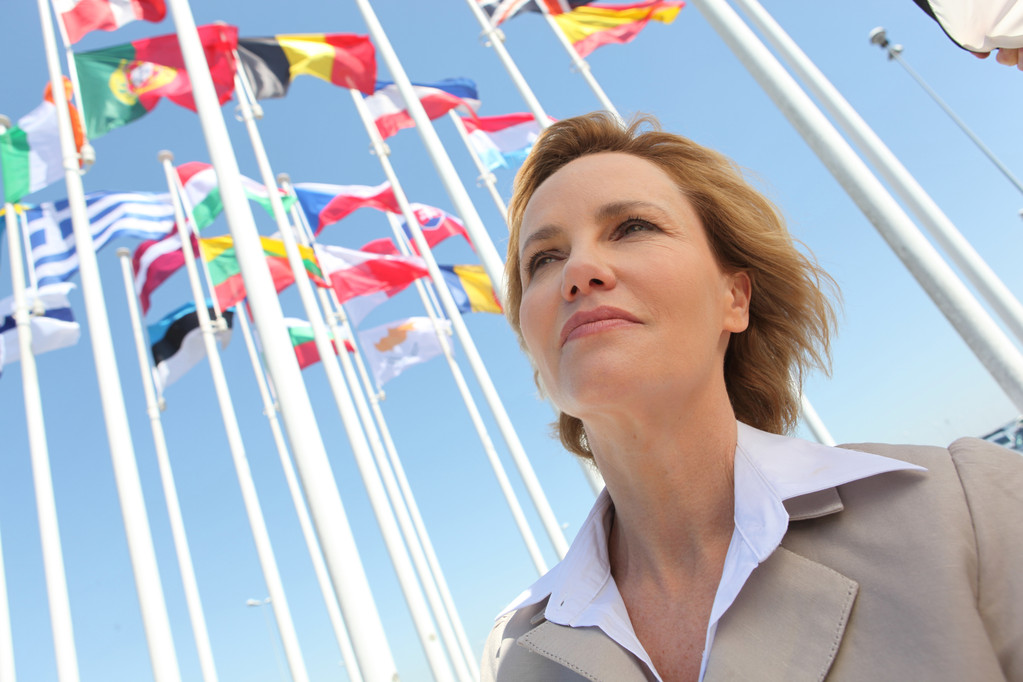 Businesswoman with flags. - Photo, Image