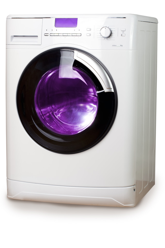A máquina de lavar roupa em um fundo branco
 - Foto, Imagem