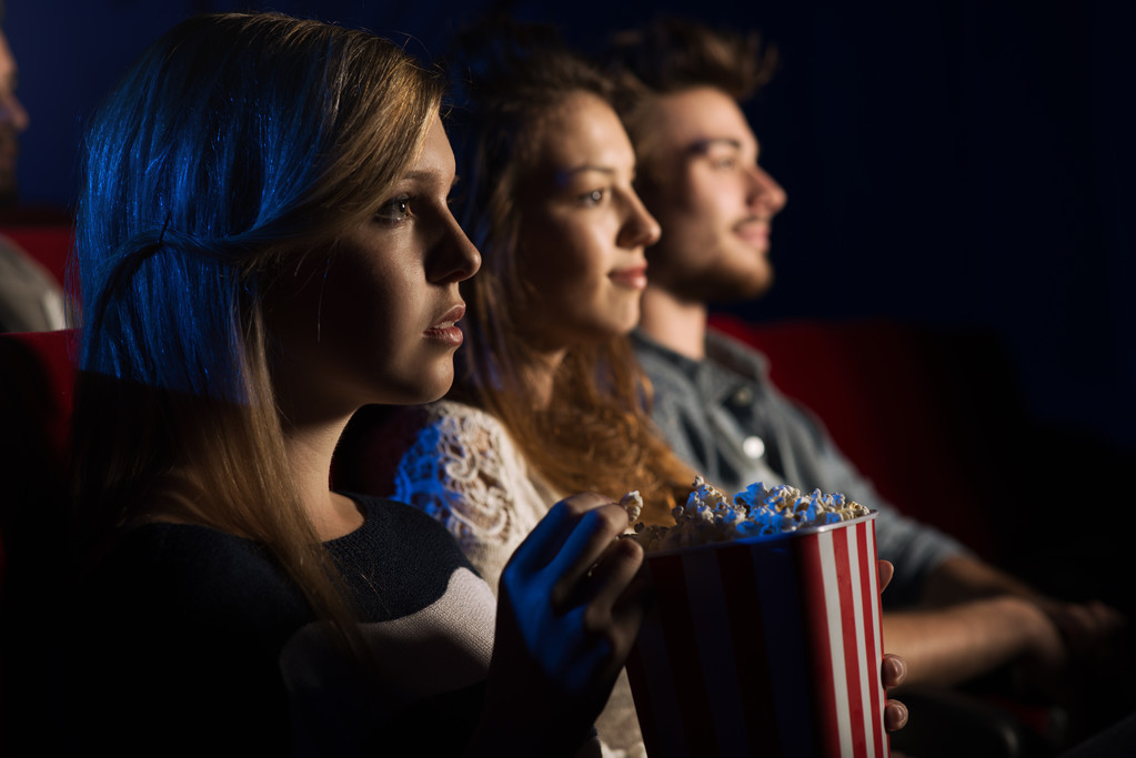 Friends at the cinema watching a movie - Photo, Image