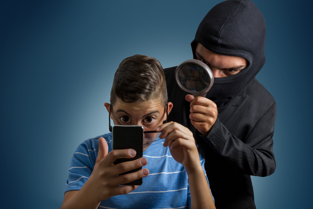 comic masked man spying data from smartphone of teenager - Photo, Image