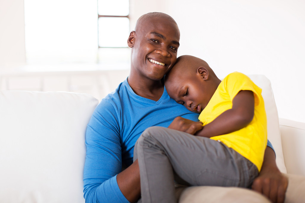 father on couch with ill son - Photo, Image