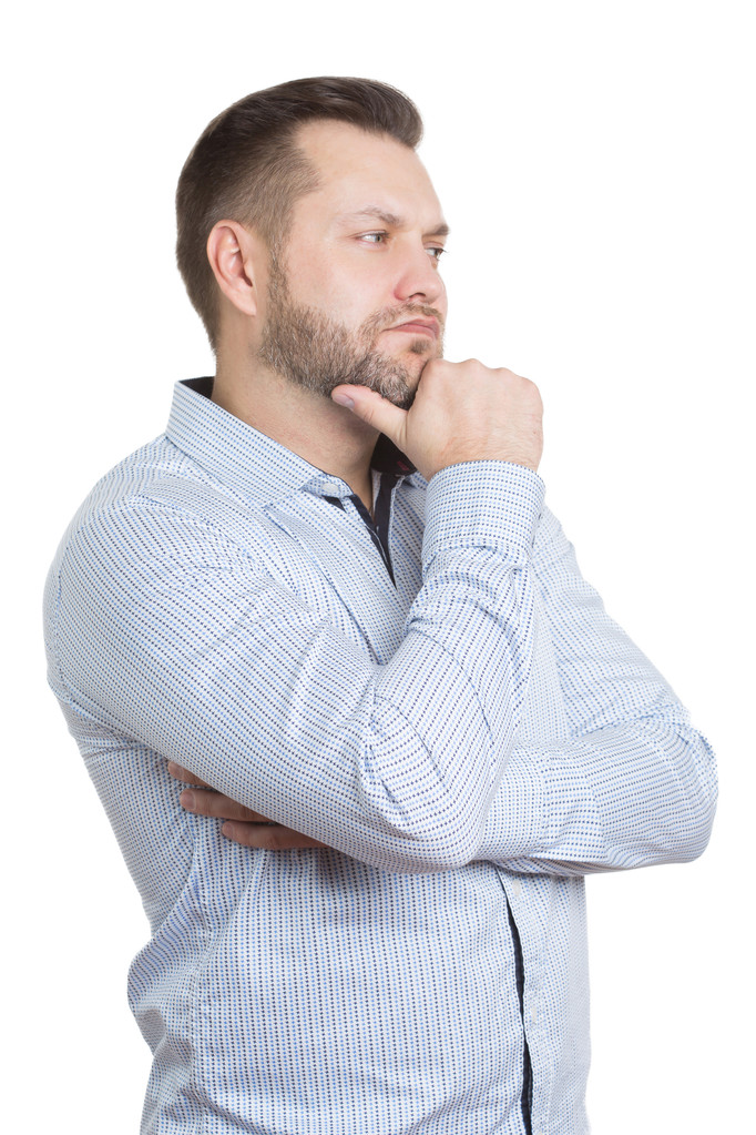 adult male with a beard. isolated on white background. Body language. non-verbal cues. training managers. touch to face. finger under his chin. - 写真・画像