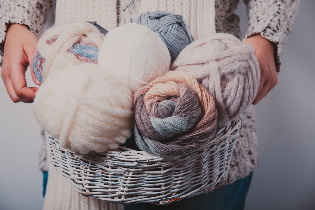 Woman with basket of balls woolen yarn - Photo, Image