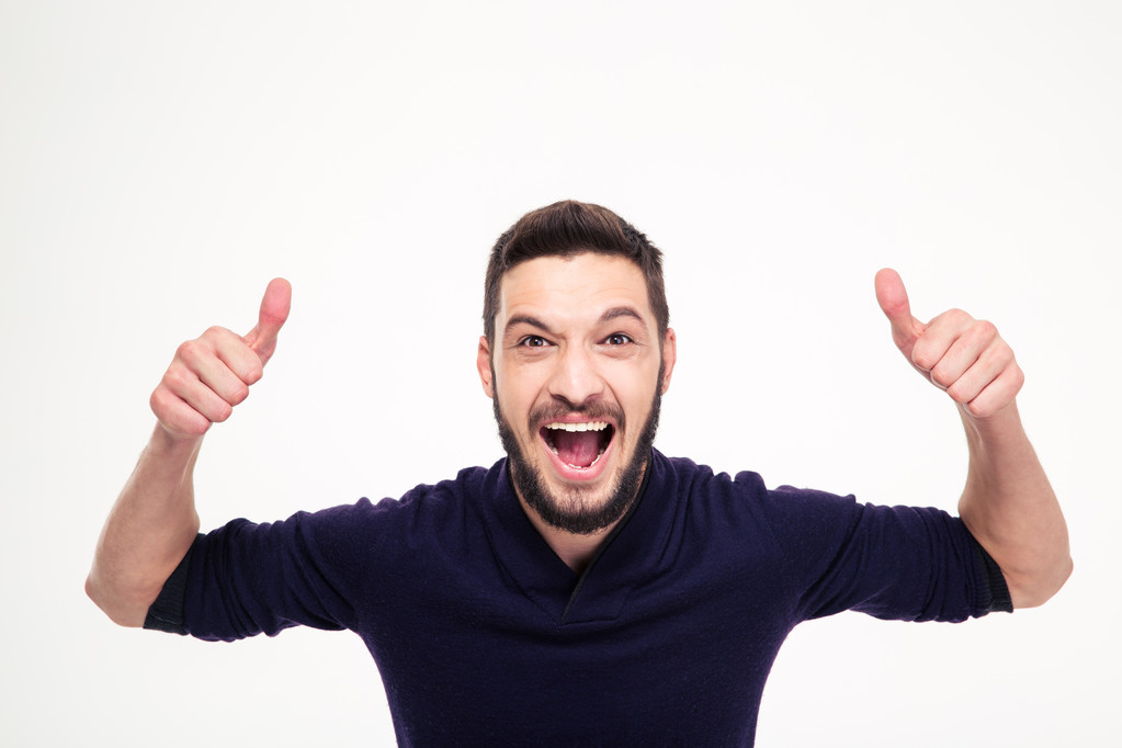Elated excited young happy man shouting and showing thumbs up  - 写真・画像