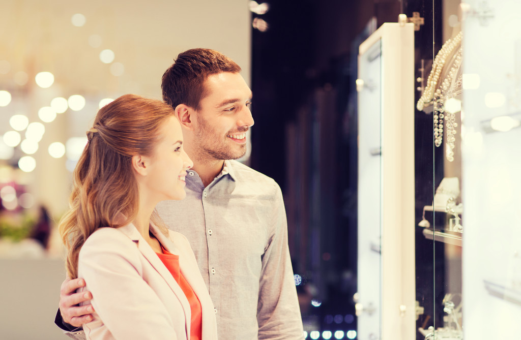 couple looking to shopping window at jewelry store - Photo, Image