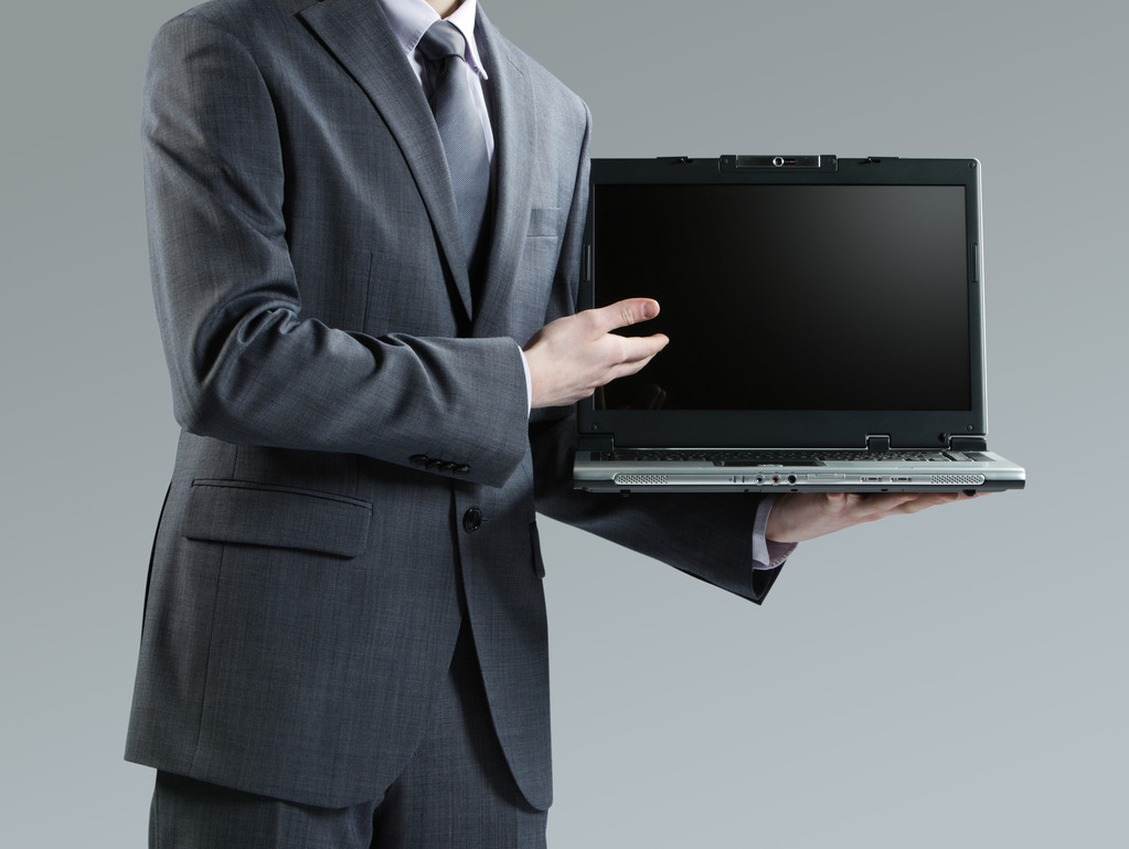 holding a laptop üzletember - Fotó, kép
