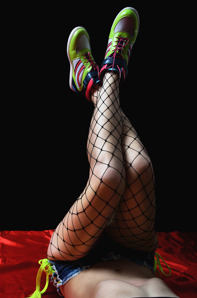Beautiful girl in sexy shorts and stockings. Photo of girl close - Φωτογραφία, εικόνα