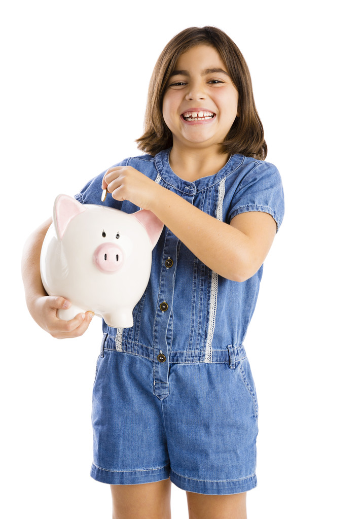 Mädchen beginnt ihre Ersparnisse auf einem Sparschwein - Foto, Bild