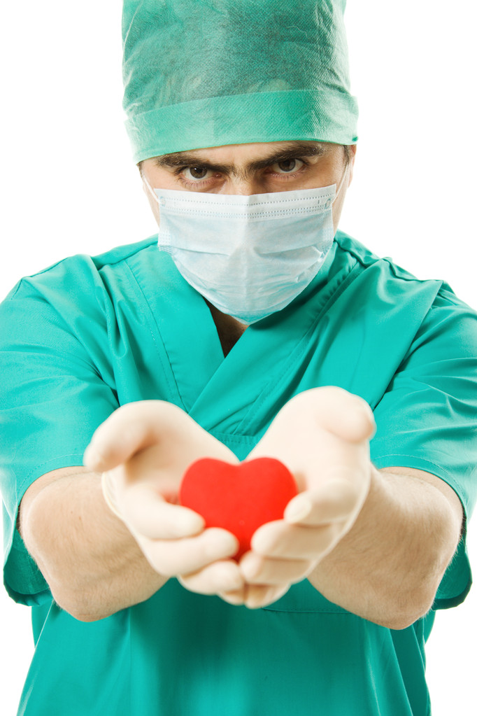 Medico maschio con un cuore in mano
 - Foto, immagini