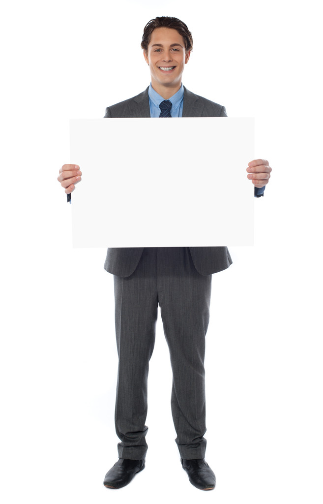 Giovane uomo d'affari tiene il cartellone in bianco
 - Foto, immagini