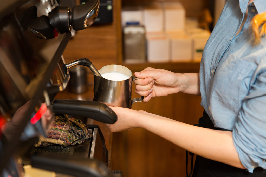 close up of woman making coffee by machine at cafe - Photo, Image