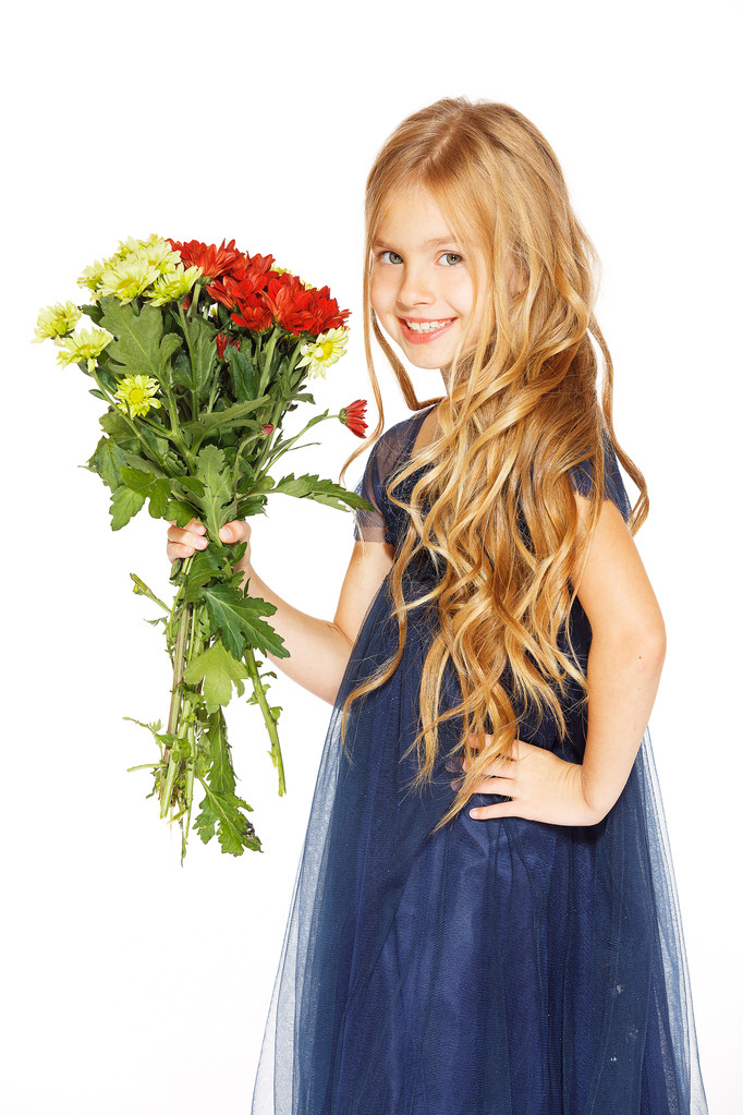 Beautiful little girl with a bouquet of flowers - Photo, Image