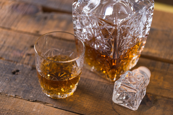 whiskey in glass on wood background - Fotoğraf, Görsel