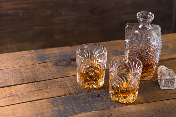 whiskey in glass on wood background - Φωτογραφία, εικόνα