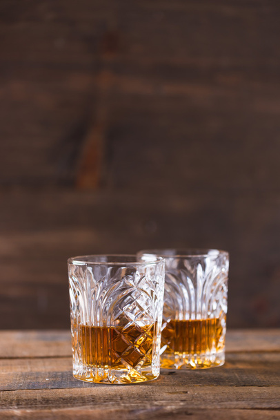 whiskey in glass on wood background - Photo, Image