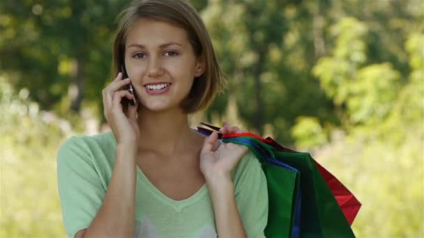 woman in colorful dress of said cellular phone - Footage, Video