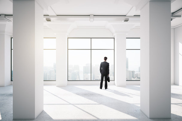 businessman standing in empty office - Photo, Image