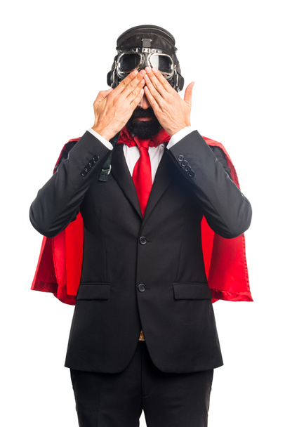 Super hero businessman covering his eyes - Photo, Image