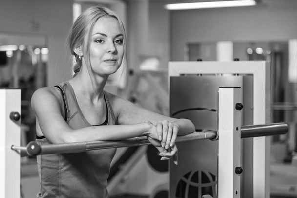 Woman at the gym. Rest between exercises. Women's fitness. Photos for sporting magazines, posters and websites. - Photo, Image