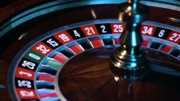 Russian roulette wheel is spinning with the small white ball is going around at the game table at casino. - Footage, Video