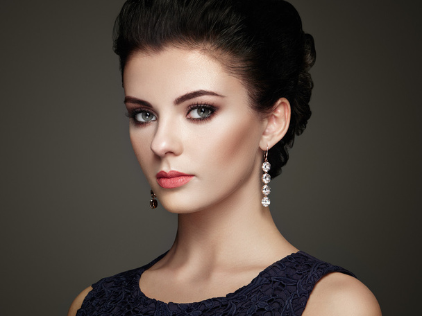 Fashion portrait of young beautiful woman with jewelry - Фото, изображение
