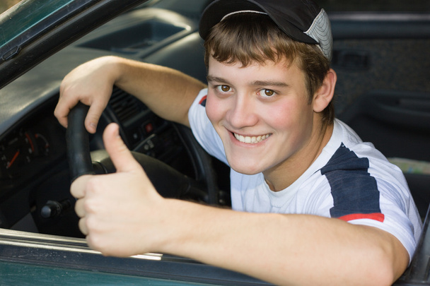 Young man in the cabin while driving - Foto, Bild