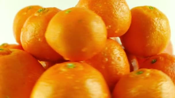 Macro Shot of Rotating Tangerines - White Background - Video