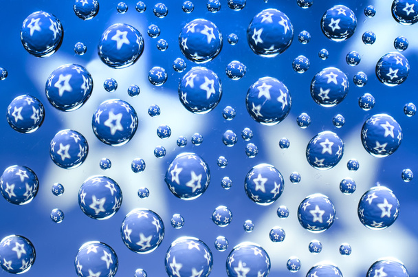 Капли воды со звездами на голубом фоне
 - Фото, изображение