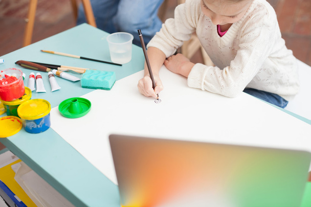 Cheerful female child is painting with grandfather - Foto, Imagem