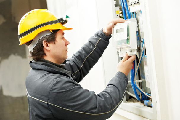 Electrician installing energy saving meter - Fotografie, Obrázek