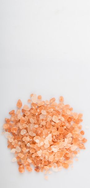 Himalayan rock salt in white bowl over grey background - Photo, Image